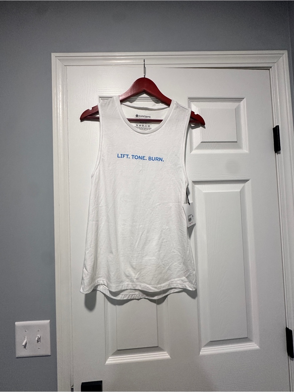 Pure Barre White Tank with Blue 'LIFT. TONE. BURN.' Text